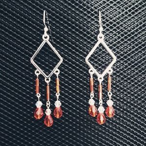 Silver diamond shapes with orange and clear iridescent glass crystal earrings